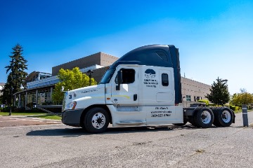 A Centralia College CDL truck parked in front of the TransAlta Commons